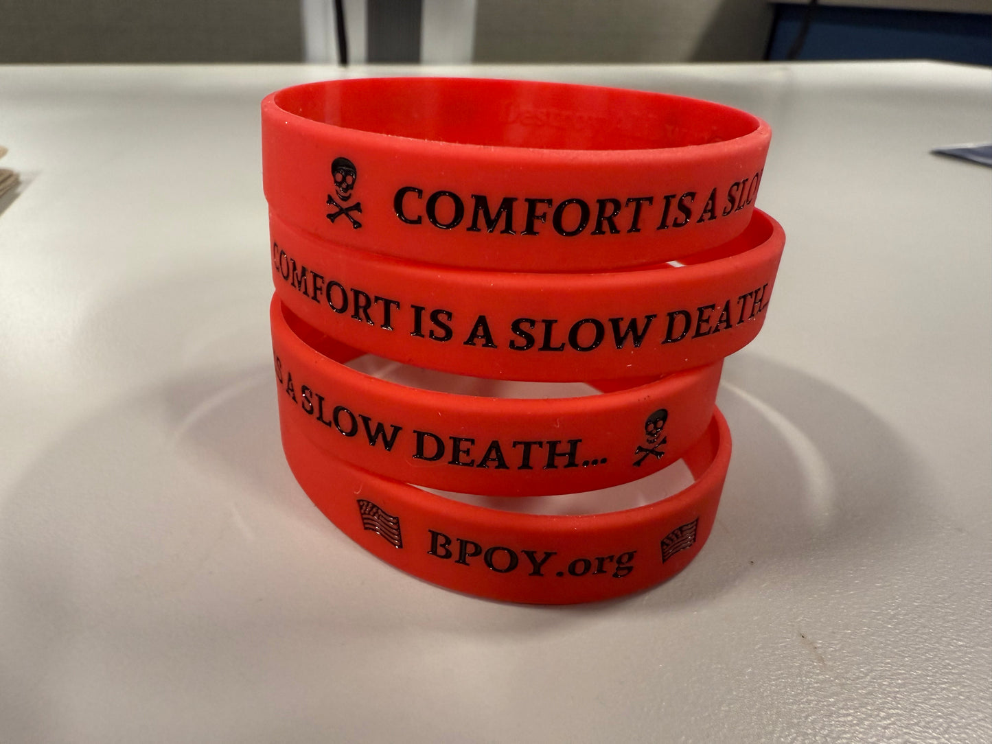 Comfort is a slow Death. Wrist Band